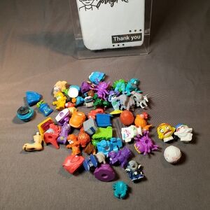 small, plastic collectible figures, Trash Pack/Zuru Smashers and others